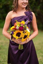 Bright fall colored bouquet, the added touch of lime green really pops against the autumnal colors. Purple And Yellow Fall Wedding Heart Love Weddings Purple Bridesmaid Dresses Wedding Flower Guide Purple Wedding Flowers