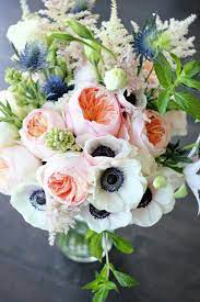 Pretty Wedding Bouquet Featuring White Anemones White Astilbe Blue Eryngium Thistle Peach Juliet Da Flower Arrangements White Flower Arrangements Flowers