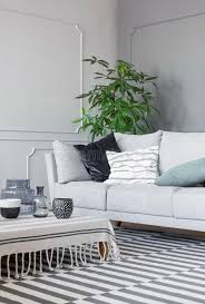 Perfect coffee table for our loungebaz972kin the usual ikea way, the coffee table was too taxi to assemble and the finished product really enhanced our living space5. Patterned Rug And Coffee Table With Mugs And Glass Vases In The Stylish Living Room With Grey Sofa Stock Photo Image Of Coffee Bright 130778088