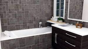 The bathtub of volcanic limestone and resin is by victoria + albert, and a ladder shelf keeps towels at a hand's reach. Small Bathroom Bathroom Tiles Design In Tamilnadu Novocom Top