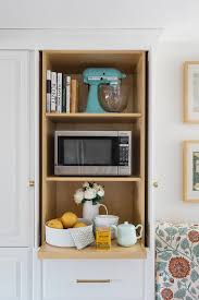 A microwave cabinet may be built into the top row of cabinets, the lower cabinets or as a separate. Hidden Microwave Design Ideas