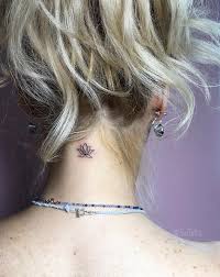 Across the ages, the lotus flower has stood for different things across different cultures, including: Tiny Lotus Flower Tattoo On The Neck Tattoo Designs For Women