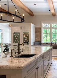 Cream Kitchen Cabinets Granite Countertops Brass Faucets Exposed Wood Ceili In 2020 Kitchen Cabinets And Granite Granite Countertops Kitchen Cream Kitchen Cabinets