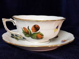 A saucer is a small curved plate on which you stand a cup. Ships Free Herend Market Garden Footed Cup And Saucer Set Etsy Cup And Saucer Set Herend Market Garden