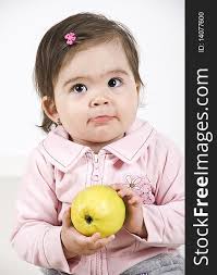 Sulky Baby Holding An Apple Free Stock Images Photos 14077600 Stockfreeimages Com