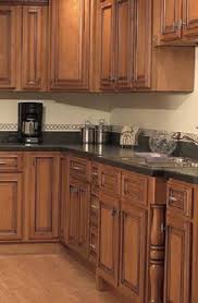 Medium Stained Maple Cabinets With A Rich Dark Brown Glaze Perfect For Our Future Kitche Kitchen Design Small Cottage Kitchen Cabinets Kitchen And Bath Design