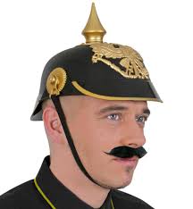 The pickelhaube, plural pickelhauben, is named from the old german pickel, meaning point or pickaxe, and haube, meaning bonnet, a general word for headgear. Pickelhaube Schwarz Gold Online Kaufen Stoffmeile De
