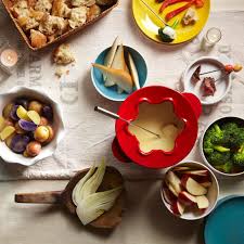 A fondue party centers around a pot of fondue, also known as melted cheese or chocolate. Dippers And Accompaniments For Cheese Fondue