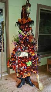 Halloween Tree Decoration Ideas With A Broom With Lights Ornaments And Hats And Letters For Halloween Tree Decorations Halloween Trees Halloween Christmas Tree