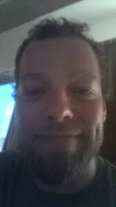 Found another oldie. Must be 6 years old. Us not the photo!! Looking  staunch Todd Sheridan. 🤨 I look terrified.