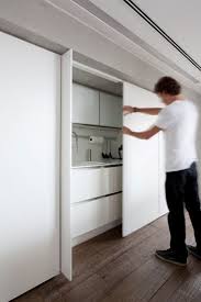 Dekostile.com is your first and best source for all of the information you're looking for. Disappearing Act 14 Minimalist Hidden Kitchens Remodelista Hidden Kitchen Kitchen Sliding Doors Diy Kitchen Decor