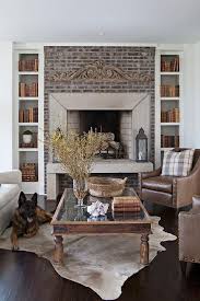 Bookcases and shelves flanking the fireplace help enhance this natural focal point. Fireplace Bookshelves Design Ideas