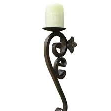 Its cast brass frame is decorated with roccoco scrolls and is surmounted with a beautiful maidens face mask and has a further face mask at. List Of Products Tagged Decorative Wall Sconces Candle Holders Shoreline Ornamental Iron
