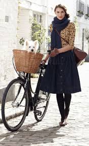 Cycle Lady With Retro Bike Denim Midi Skirt Leather Bag Big Blue Knitted Scarf Black Tights Low Heeled Shoes And Cute Outfit Outfit Ideen Mode Inspiration
