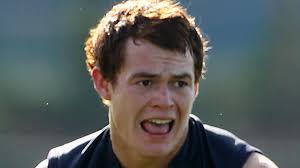 Josh Tynan signs at St Kevin's