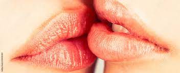 Lesbian couple kiss lips. Passion and sensual touch. Closeup of women  mouths kissing. Lip care and beauty. Closeup of beautiful young woman  healthy lips. Two beautiful sexy lesbians in love Photos |