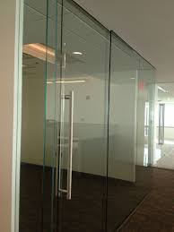 Oasis glass entrance systems are the perfect solution for dividing interior office space and corridors as well as creating interior store fronts, conference rooms and storage areas. Transwestern Md Frameless Glass Office Fronts With Sliding Glass Doors Glass Office Doors Commercial Glass Doors Glass Doors Interior