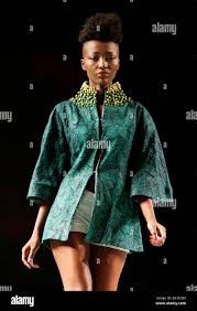 A model displays a creation by designer ADE BAKARE during Africa  International Fashion Week in Lagos, Nigeria, Friday, Dec. 5, 2014. (AP  Photo/Sunday Alamba Stock Photo