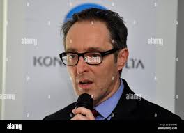 Senior Director for Business Innovation at Konica Minolta Business  Technologies Dennis Curry speaks during the opening of Konica Minolta  innovation centre in Brno, Czech Republic, March 18, 2015. Company wants to  employ