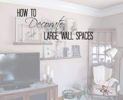 Find decorating a long wall. How To Decorate A Large Wall Family Room Wall Decor Family Room Walls Wall Decor Living Room