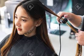 أجمل فتاة بتقطيعة الشعر الجميلة. Young Asian Beautiful Woman Having Her Hair Cut At The Hairdresser S Scissors Stock Photo Picture And Royalty Free Image Image 142942885