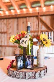 Rustic Barn Wedding Reception Decor Wine Bottles And Sunflowers As Centerpieces Rustic Barn Wedding Reception Barn Wedding Decorations Barn Wedding Reception