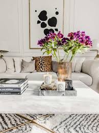 Coffee table decor is easy to do on your own and really adds personality to your living room. Getting My Home Ready For Fall Coffee Table Books Decor Coffee Table Decor Living Room Diptyque Decor