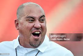 Quarterback Johnny Stanton of the UNLV Rebels hits tight end Tim Holt...  News Photo