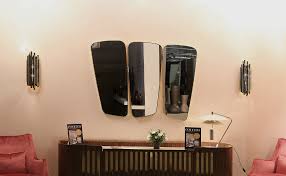 This mirror has a geometric octagon form with a warm gold finish on its frame for a sophisticated, modern look *quality materials: 10 Mid Century Modern Wall Mirrors For An Exceptional Home Decor