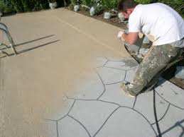Reed a30 rockmaster pump is shown here pumping a very low slump shotcrete mix onto the dirt and rebar in the hole in the ground to create the concrete sh. Moon Decorative Concrete If You Are Resurfacing A Pool Deck Consider A Concrete Class Moon Decorative Concrete