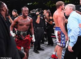 Logan paul, left, towers over floyd mayweather during their media availability this week. Izyw6pk2pi14tm