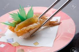 Toss everything well so that the shrimp are completely covered. Chopsticks Grabbing Soy Sauce Marinated Shrimp Sushi On A Round Pink Plate Stock Photo Picture And Royalty Free Image Image 111946851