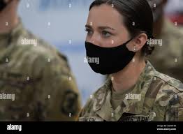 U.S. Army Spc. Ashlyn Nelson, Shawnetown, Illinois native and 123rd  Engineering Battalion combat engineer listens to Illinois National Guard  leadership in the Belle-Clair vaccination site, Belleville, Illinois, April  20, 2021. Nelson is