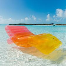 This Massive Rainbow Pool Float Lounger Works On Land Too Cool Pool Floats Summer Pool Floats Cute Pool Floats