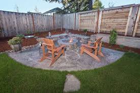 Buildings fire pit on a slope. Firepit Sloped Backyard Paradise Restored Landscaping