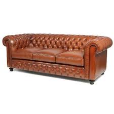 Both the armrests and the sofa's back typically curve outwards towards the top of the sofa, giving it an unmistakable look. Chesterfield Sofas The Shop My Club Chair