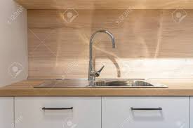 Kitchen sink faucets for granite countertops. New Modern Faucet And Kitchen Room Sink Closeup With Island And Stock Photo Picture And Royalty Free Image Image 131972242