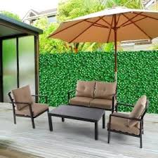 Hampton Bay Laurel Oaks 4 Piece Brown Steel Outdoor Patio Conversation Seating Set With Standard Putty Tan Cushions 505 0370 000 The Home Depot Furniture Sofa Set Conversation Set Patio Deep Seating