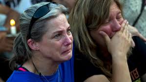 Grief in small town: March honors victims of newsroom attack