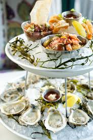 seafood tower mollusks shellfish finfish marinated raw and cooked accoutrements easy seafood recipes seafood restaurant seafood