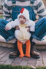 You can even dress it up with a bow. Dad Holding Baby In Chicken Costume By Gabrielle Lutze