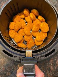 How to make frozen chicken nuggets in air fryer. Air Fryer Frozen Chicken Nuggets Melanie Cooks