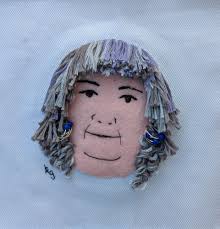 I finally finished Andrea, complete with her beaded guitar string earrings. 