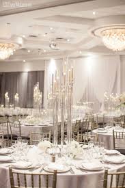 An Ultra Modern White Wedding Elegantwedding Ca In 2020 Candelabra Wedding Crystal Candelabra Wedding Wedding Table Settings