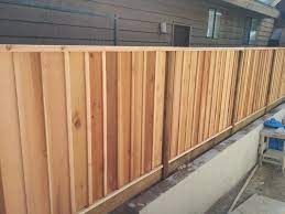 A board batten fence is a simple line of vertical this fence is mainly left natural and sometimes it is stained. Nice Little Cedar Board And Batten Fence Farmhouse Bench Diy Fence Styles Cedar Fence