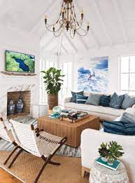 My Favorite Elements In A Beach House Are Crisp White Walls Exposed Natural Wood And Com Coastal Decorating Living Room Coastal Living Rooms Beach House Decor