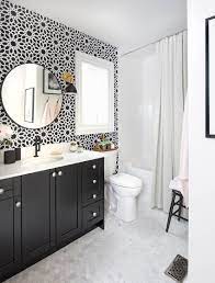 The white fixtures of the bathroom such as the sink, the bathtub, and the toilet go perfectly against the moody charcoal grey. 20 Gorgeous Black Vanity Ideas For A Stylishly Unique Bathroom