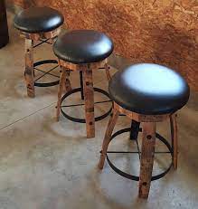 A true mancave or entertainment piece. Whiskey Barrel Stave Bar Stools With Cushioned Swivel Seats Etsy In 2021 Barrel Table Bar Stools Barrel Furniture