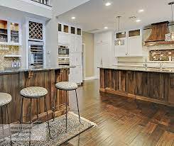 When you see tan floors with strong wood grains, such as you have in some oaks and walnuts, you plus, the cabinets will be directly on top of the floor. Casual Walnut Cabinets In Riverbed Finish