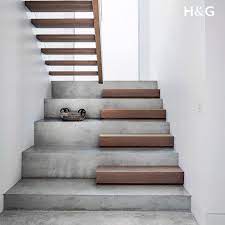 An Opaque Full Height Window Illuminates This Beautifully Simple Thoroughfare The Stairs Are Polished Concret Home Stairs Design Interior Stairs Stairs Design